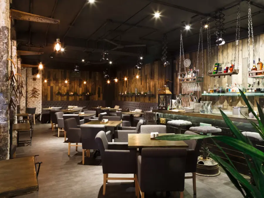 The dining room of an upscale restaurant with warm lighting