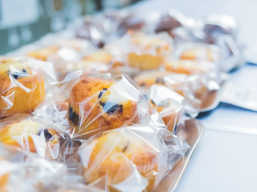 Individually wrapped muffins and pastries on a counter