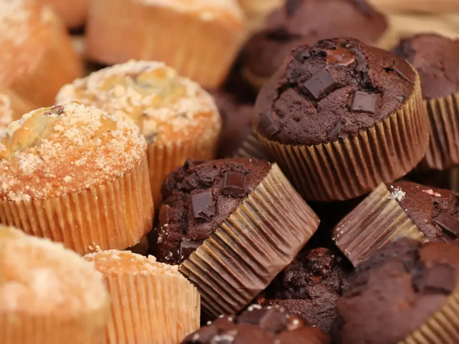 Corn and chocolate muffins in paper wrappers